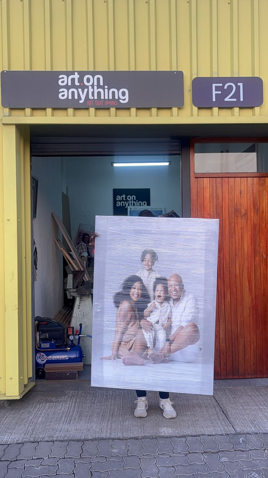 Family portrait canvas at the studio door
