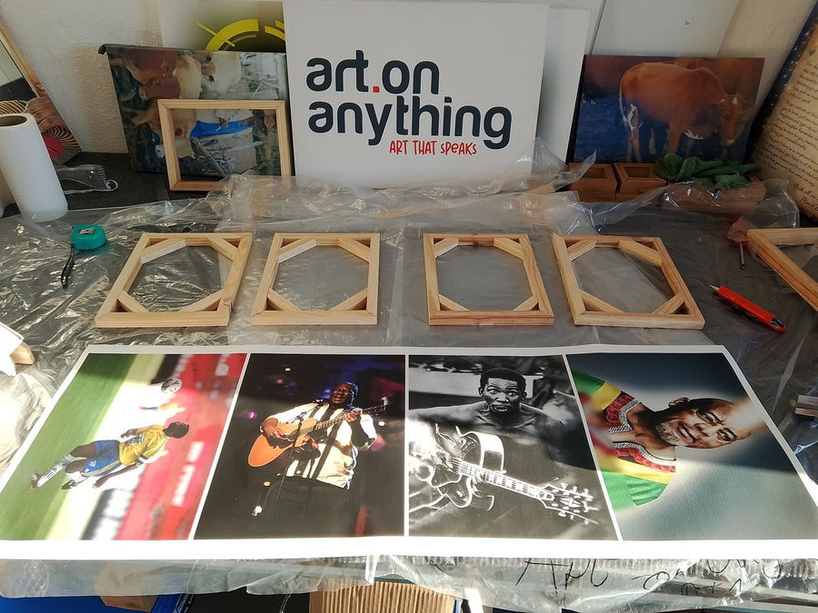 Frames and prints being prepared in the workshop
