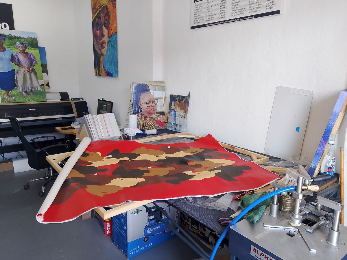 Canvas print being prepared for stretching in the studio