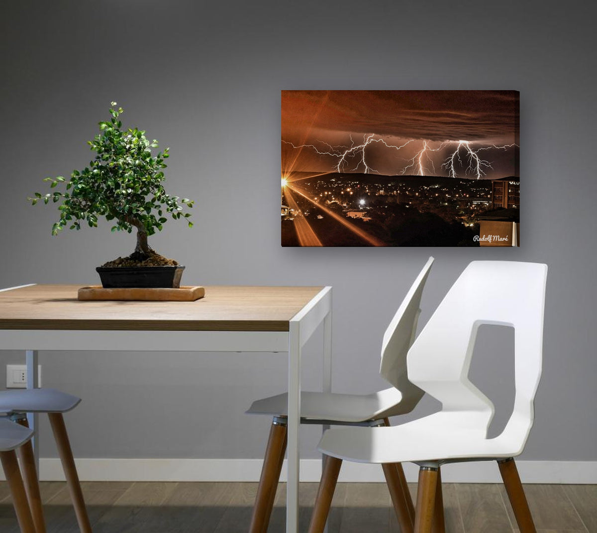 Lightning Over the Town by Rudolf Maré canvas print in a dining nook