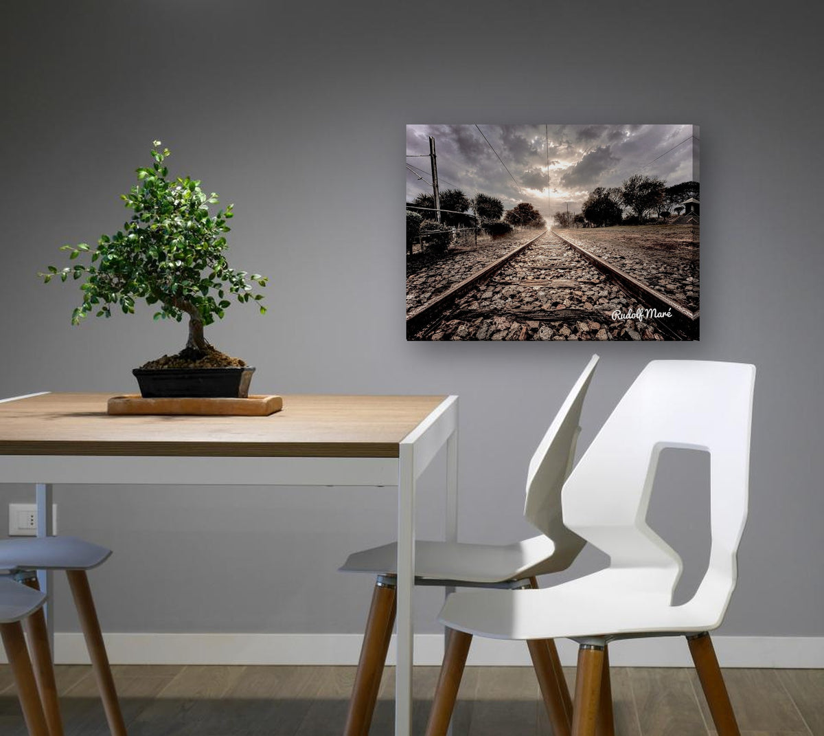 Railway Tracks Under Stormy Skies by Rudolf Maré canvas print in a dining nook