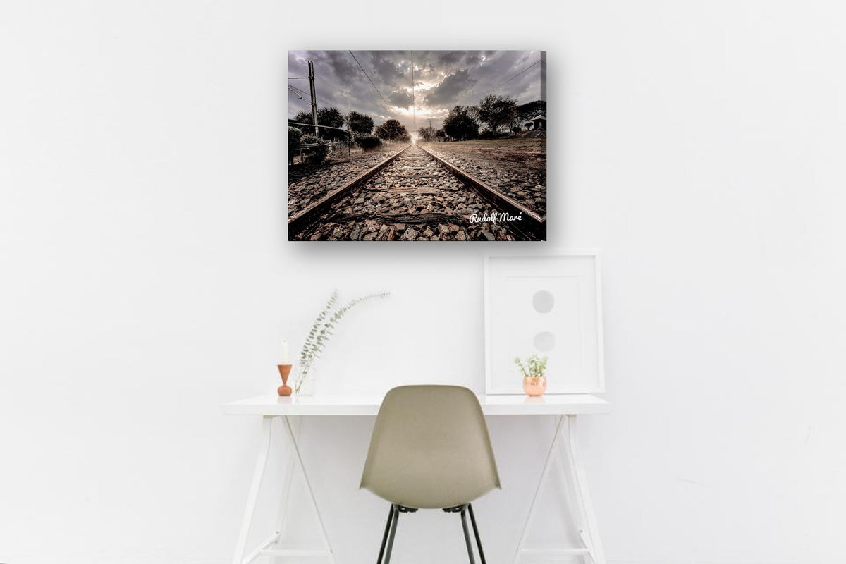 Railway Tracks Under Stormy Skies by Rudolf Maré canvas print in a home office
