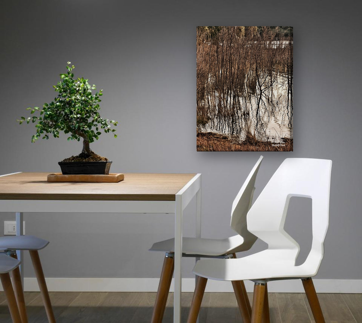 Reeds Reflected in Water by Rudolf Maré canvas print in a dining nook