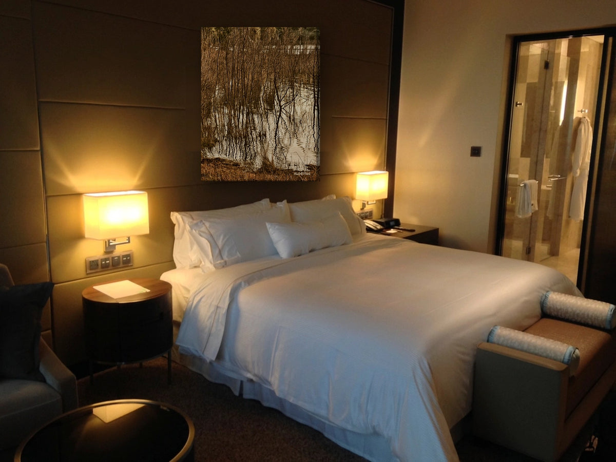 Reeds Reflected in Water by Rudolf Maré canvas print in a bedroom