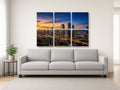 6-Panel Grid canvas print of a city skyline hanging above a sofa in a modern living room